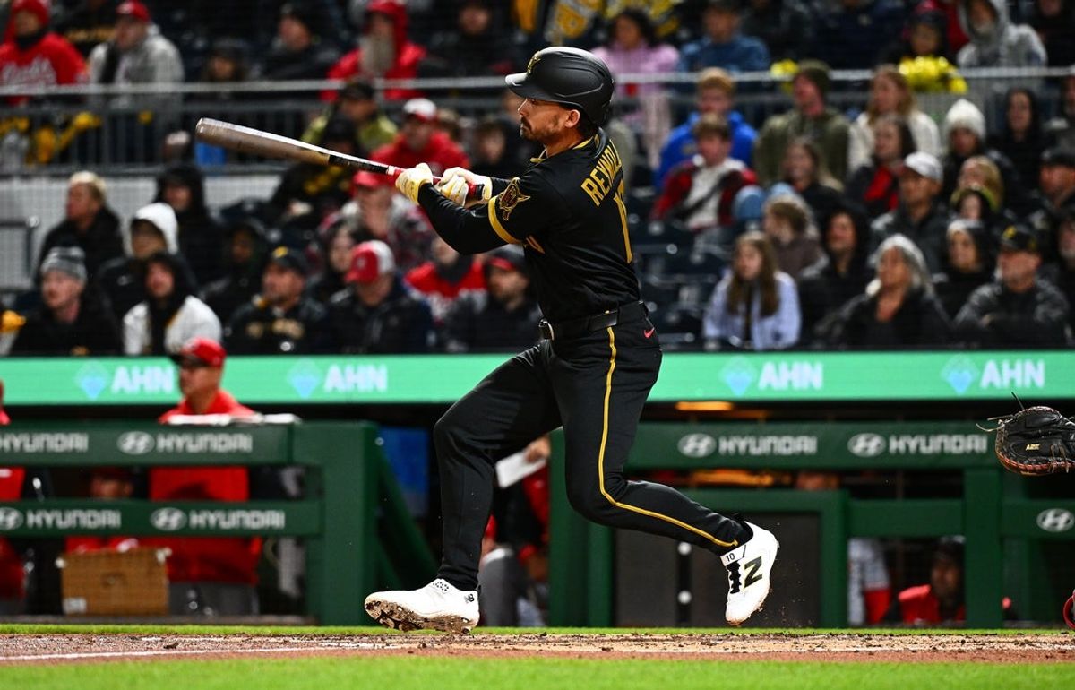 May 1, 2026; Pittsburgh, Pennsylvania, USA; Pittsburgh Pirates left fielder Bryan Reynolds (10) hits an RBI triple against the Cincinnati Reds during the third inning at PNC Park. Mandatory Credit: Justin Berl-Imagn Images