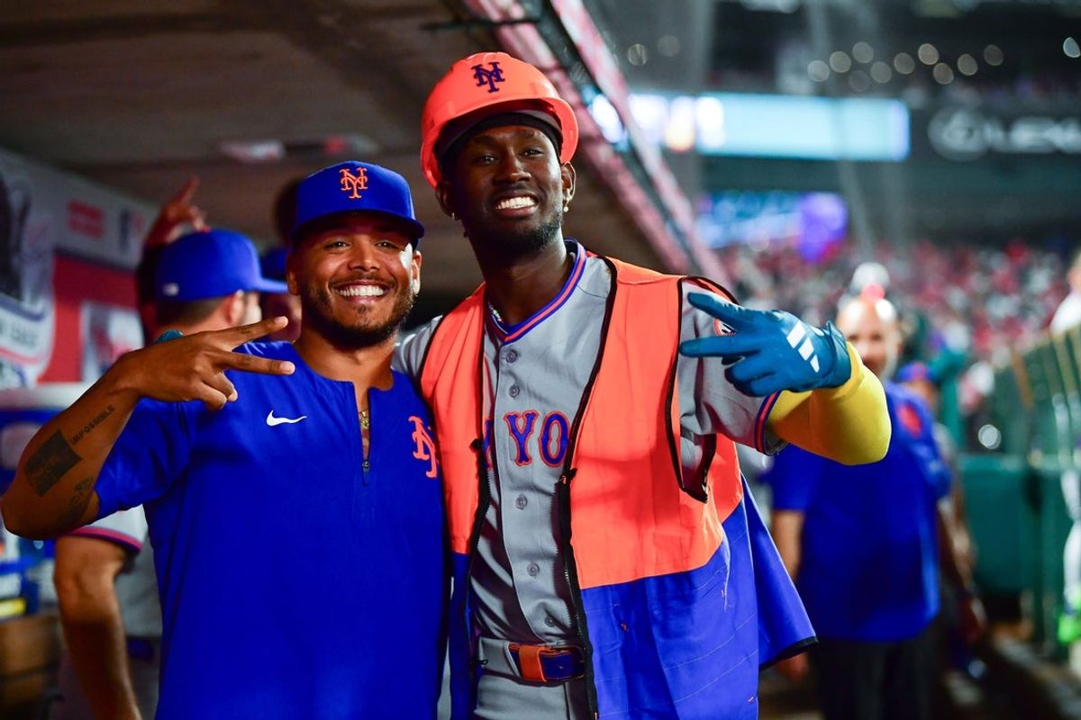 May 1, 2026; Anaheim, California, USA; New York Mets shortstop Ronny Mauricio (0) celebrates his solo home run against the Los Angeles Angels with pitcher Freddy Peralta (51) during the sixth inning at Angel Stadium. Mandatory Credit: Gary A. Vasquez-Imagn Images