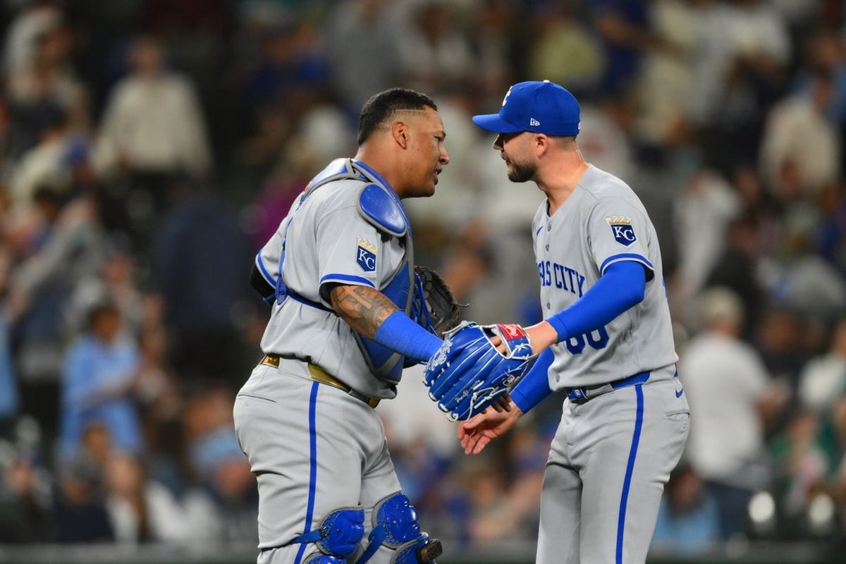 May 1, 2026; Seattle, Washington, USA; Kansas City Royals catcher Salvador Perez (13) and relief pitcher Lucas Erceg (60) celebrate defeating the Seattle Mariners at T-Mobile Park. Mandatory Credit: Steven Bisig-Imagn Images