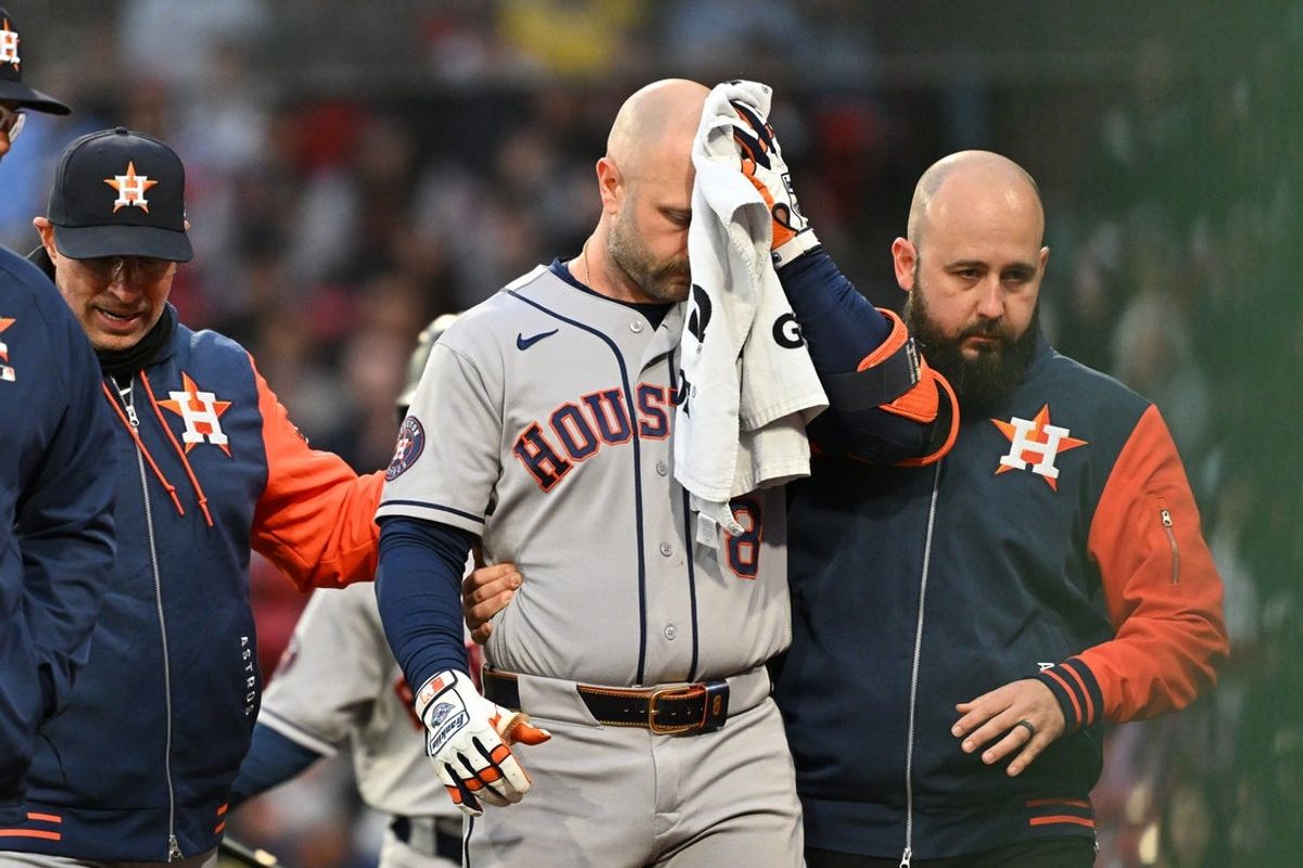 May 2, 2026; Boston, Massachusetts, USA; Houston Astros first baseman Christian Walker (8) is helped off the field after being hit by a pitch during the ninth inning against the Boston Red Sox at Fenway Park. Mandatory Credit: Eric Canha-Imagn Images