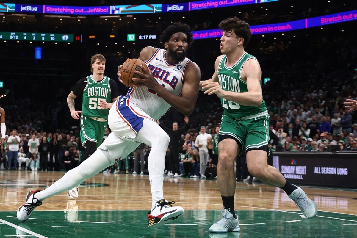 May 2, 2026; Boston, Massachusetts, USA; Philadelphia 76ers center Joel Embiid (21) drives on Boston Celtics guard Hugo Gonzalez (28) during the second quarter of game seven of the first round of the 2026 NBA Playoffs at TD Garden. Mandatory Credit: Winslow Townson-Imagn Images