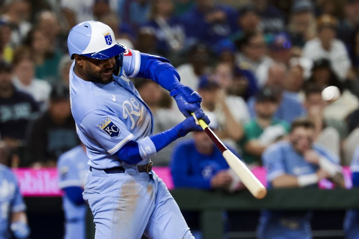 May 2, 2026; Seattle, Washington, USA; Kansas City Royals third baseman Maikel Garcia (11) hits an RBI-sacrifice fly against the Seattle Mariners during the tenth inning at T-Mobile Park. Mandatory Credit: Joe Nicholson-Imagn Images