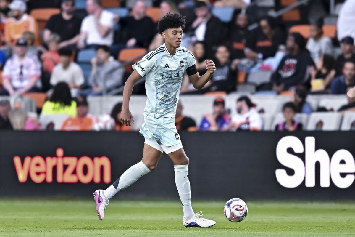 May 2, 2026; Houston, Texas, USA; Colorado Rapids defender Lucas Herrington (22) dribbles the ball during the first half against the Houston Dynamo at Shell Energy Stadium. Mandatory Credit: Maria Lysaker-Imagn Images