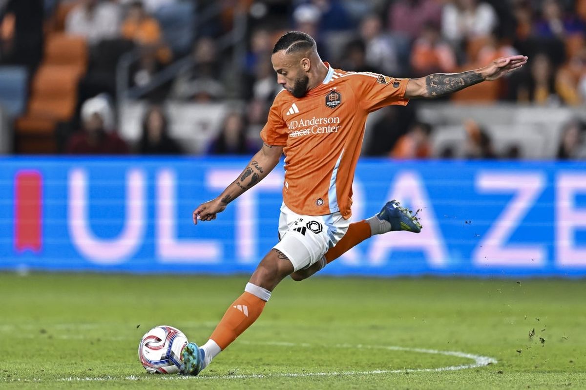 May 2, 2026; Houston, Texas, USA; Houston Dynamo forward Guilherme Augusto (20) dribbles the ball during the second half against the Colorado Rapids at Shell Energy Stadium. Mandatory Credit: Maria Lysaker-Imagn Images