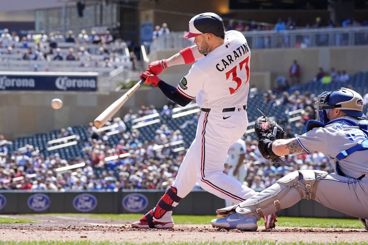 May 3, 2026; Minneapolis, Minnesota, USA; Minnesota Twins catcher Victor Caratini (37) hits an RBI single against the Toronto Blue Jays in the first inning at Target Field. The hit was his 500th in his career. Mandatory Credit: Bruce Kluckhohn-Imagn Images