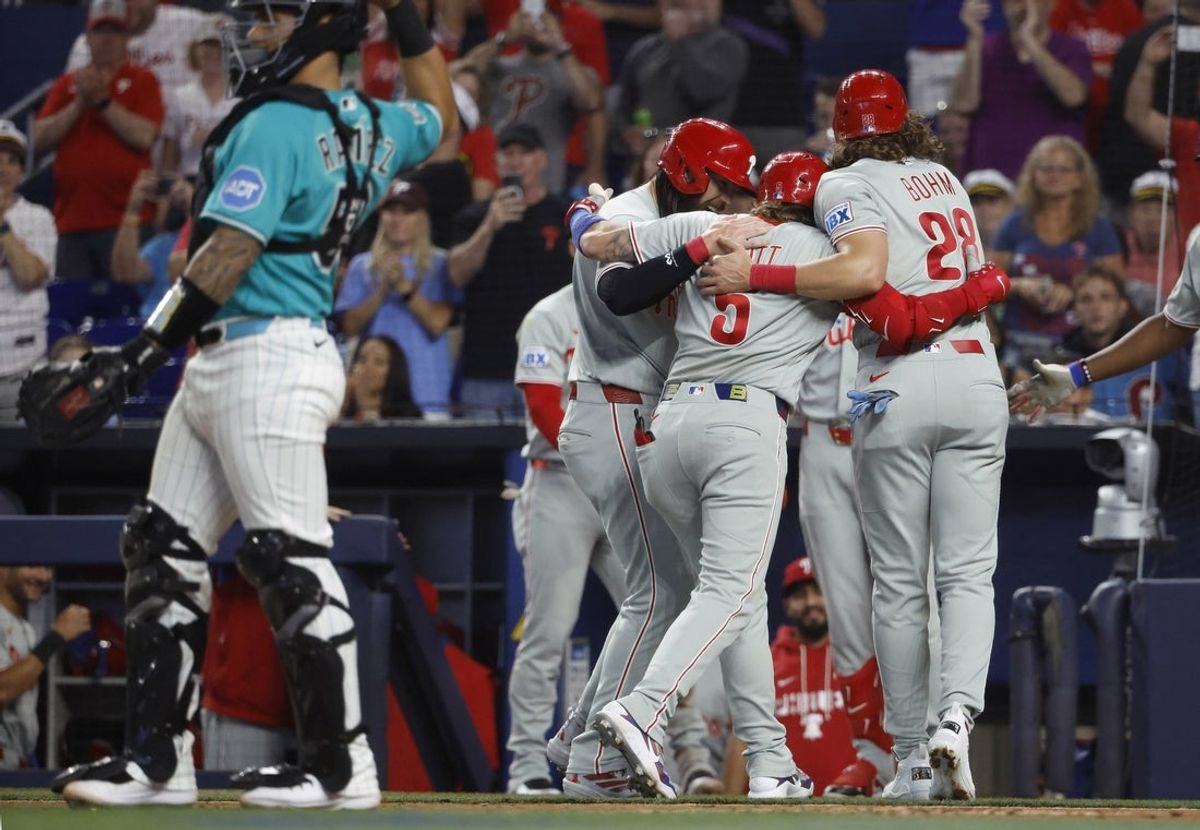 May 3, 2026; Miami, Florida, USA;  Philadelphia Phillies third baseman Alec Bohm (28) and center fielder Brandon Marsh (16) and second baseman Bryson Stott (5) celebrate at the plate after Stott's home run against the Miami Marlins during the first inning at loanDepot Park. Mandatory Credit: Rhona Wise-Imagn Images