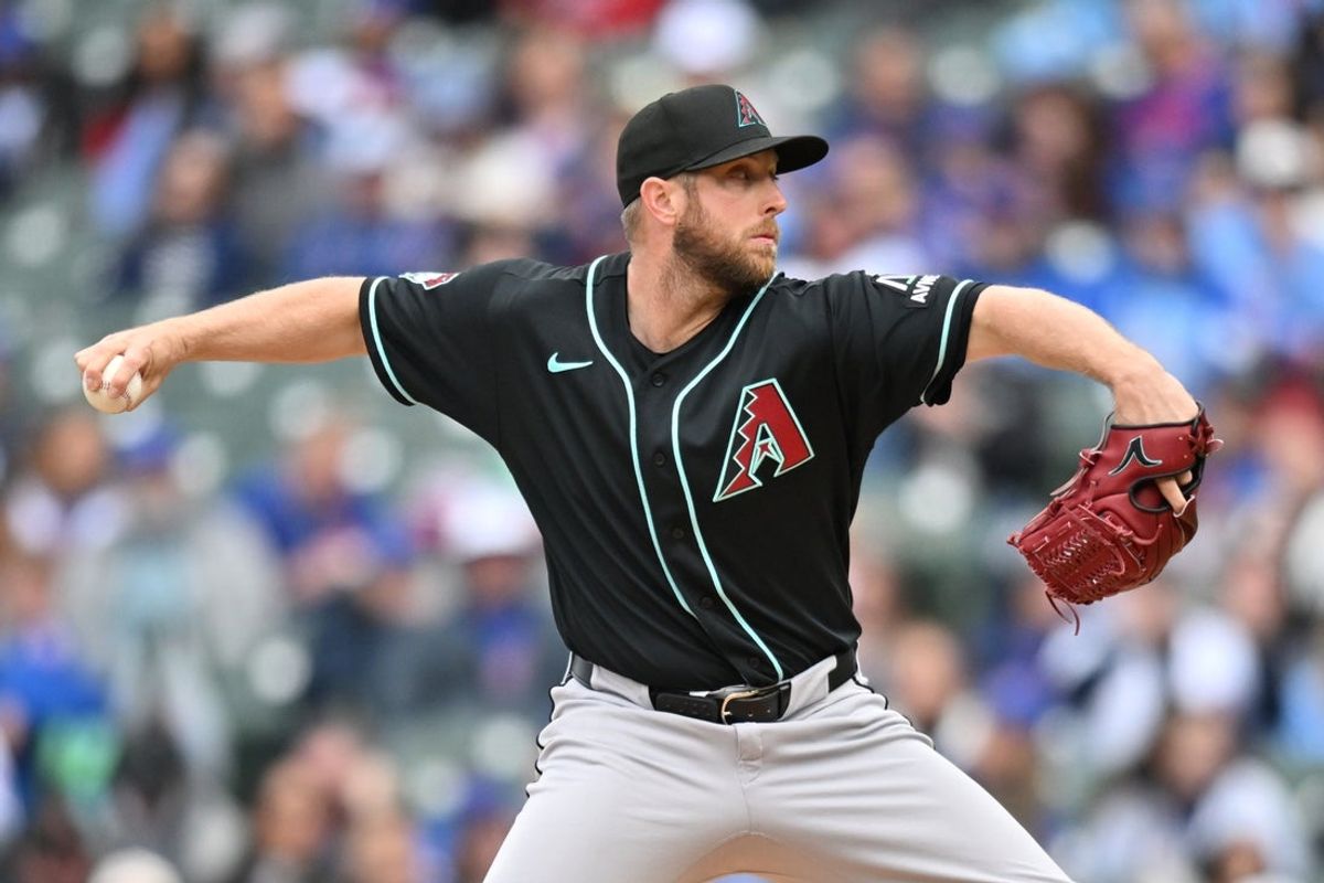 May 3, 2026; Chicago, Illinois, USA; Arizona Diamondbacks pitcher Merrill Kelly (29) pitches against the Chicago Cubs during the first inning at Wrigley Field. Mandatory Credit: Patrick Gorski-Imagn Images