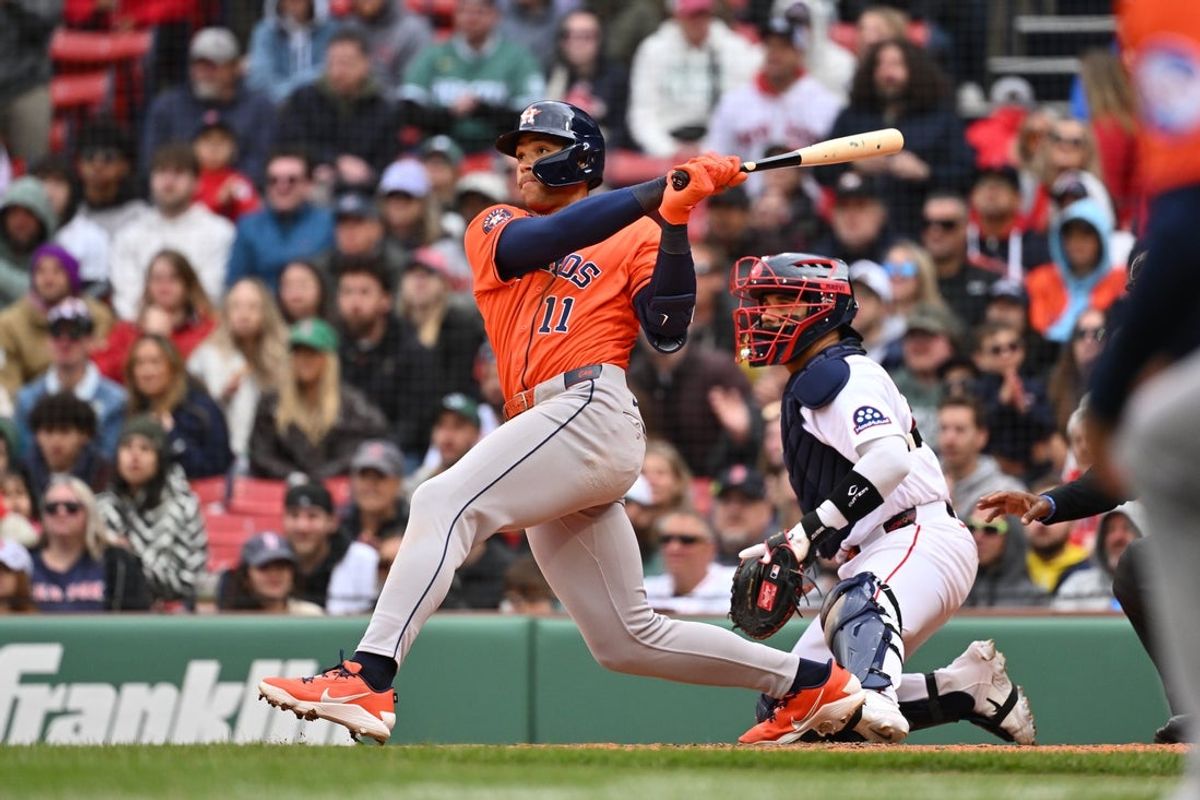 May 3, 2026; Boston, Massachusetts, USA; Houston Astros right fielder Cam Smith (11) hits a two run RBI against the Boston Red Sox during the tenth inning at Fenway Park. Mandatory Credit: Eric Canha-Imagn Images