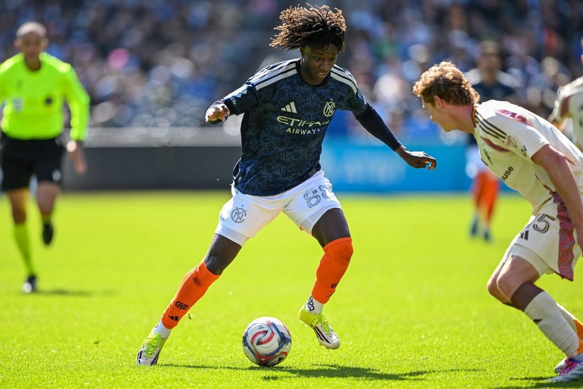 May 3, 2026; New York, New York, USA;  New York City FC forward Malachi Jones (88) dribbles the ball defended by D.C. United defender Kye Rowles (15) during the first half at Citi Field. Mandatory Credit: Mark Smith-Imagn Images