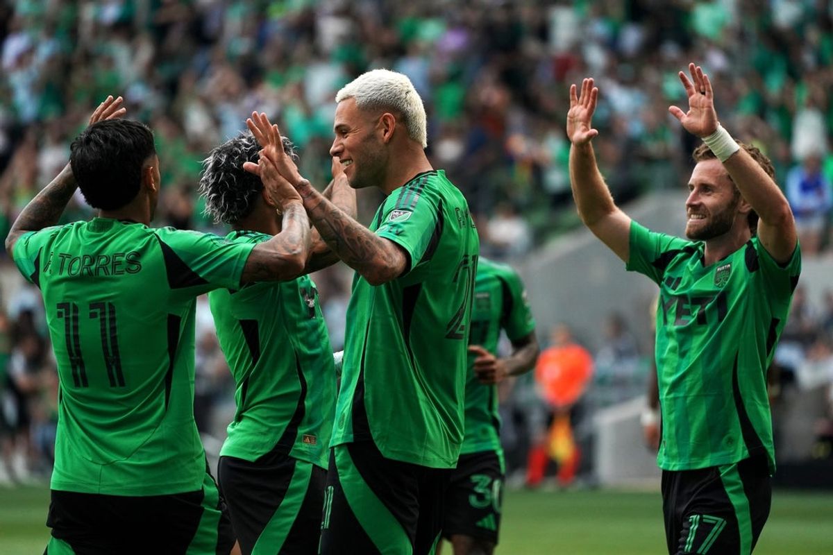 May 3, 2026; Austin, Texas, USA; Austin FC forward Christian Ramirez (21) is congratulated by teammates for making a goal against St. Louis CITY SC during the second half at Q2 Stadium. Mandatory Credit: Dustin Safranek-Imagn Images