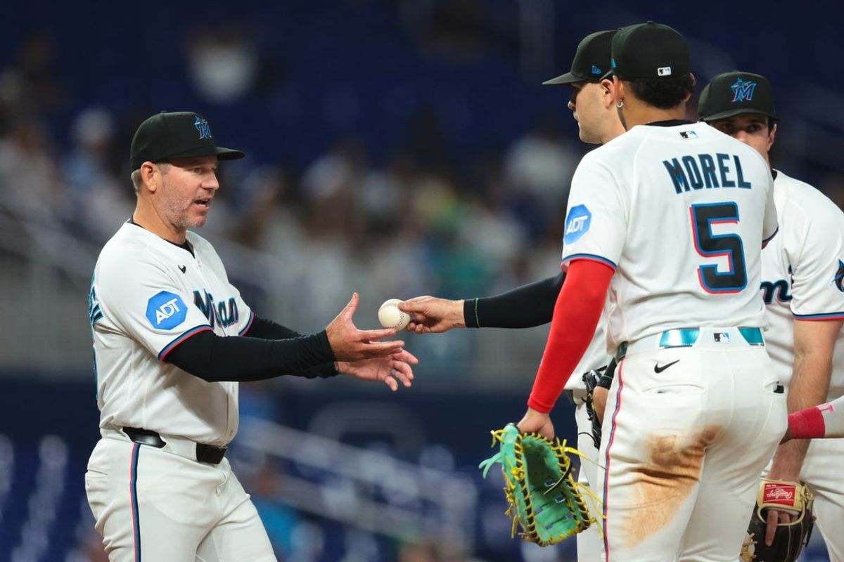 May 4, 2026; Miami, Florida, USA; Miami Marlins manager Clayton McCullough (86) takes Miami Marlins pitcher Janson Junk (26) out of the game against the Philadelphia Phillies during the sixth inning at loanDepot Park. Mandatory Credit: Sam Navarro-Imagn Images