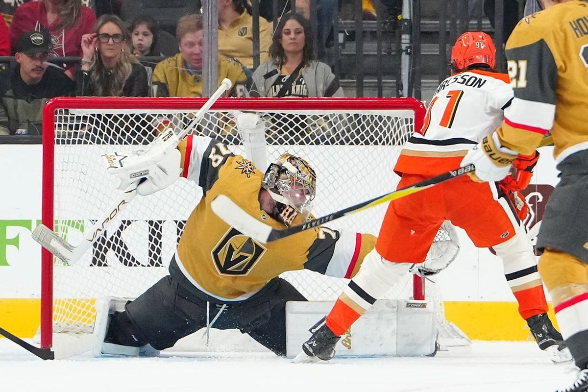 May 4, 2026; Las Vegas, Nevada, USA; Vegas Golden Knights goaltender Carter Hart (79) defends his net as a deflection by Anaheim Ducks center Leo Carlsson (91) lifts over the cross bar during the first period of game one of the second round of the 2026 Stanley Cup Playoffs at T-Mobile Arena. Mandatory Credit: Stephen R. Sylvanie-Imagn Images