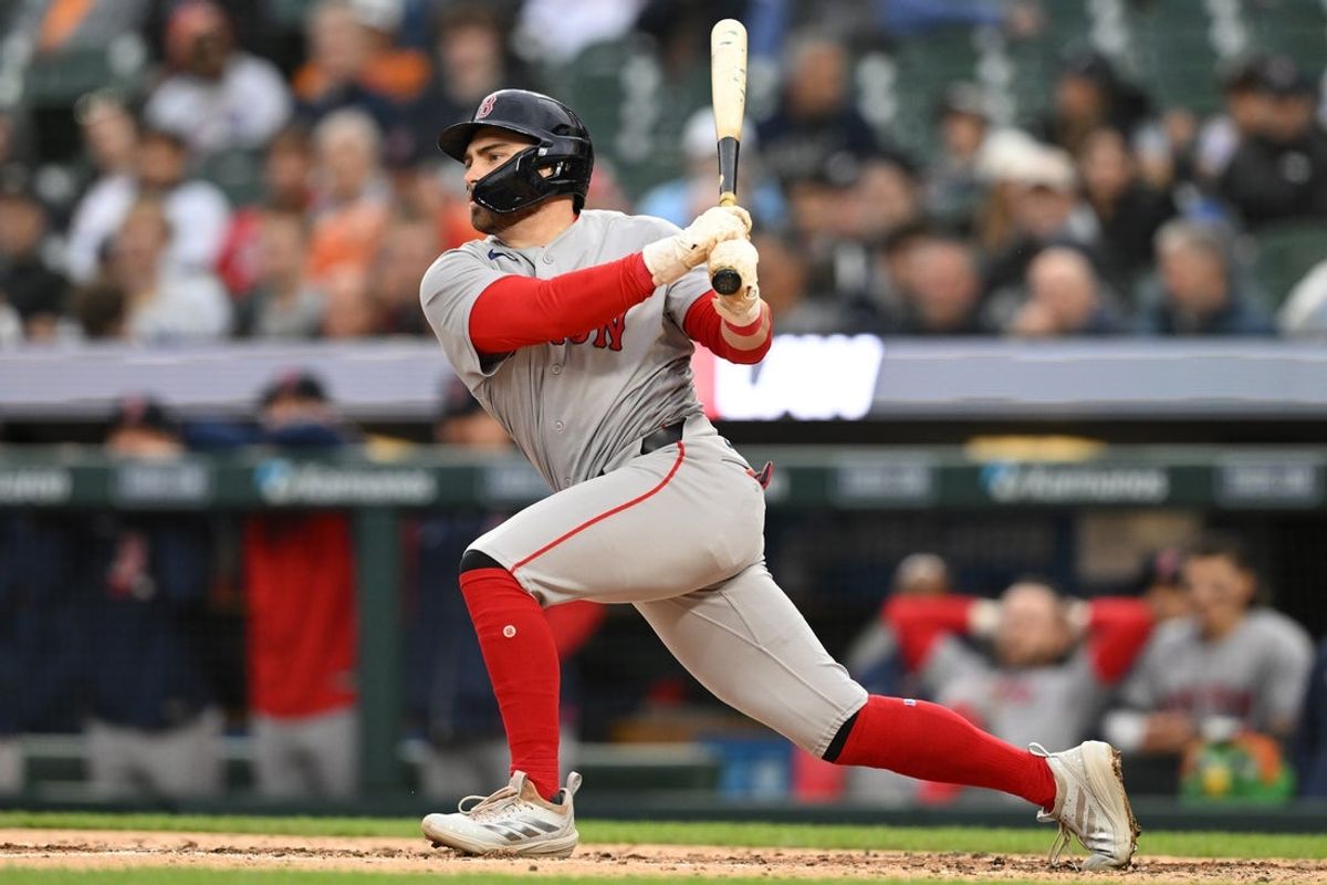 May 5, 2026; Detroit, Michigan, USA; Boston Red Sox third baseman Caleb Durbin (5) hits an RBI single against the Detroit Tigers in the third inning at Comerica Park. Mandatory Credit: Lon Horwedel-Imagn Images