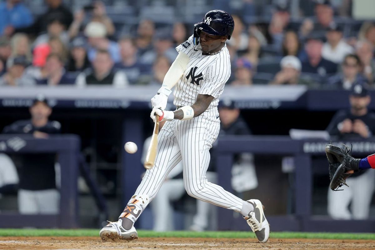 May 5, 2026; Bronx, New York, USA; New York Yankees second baseman Jazz Chisholm Jr. (13) hits a solo home run against the Texas Rangers during the sixth inning at Yankee Stadium. Mandatory Credit: Brad Penner-Imagn Images