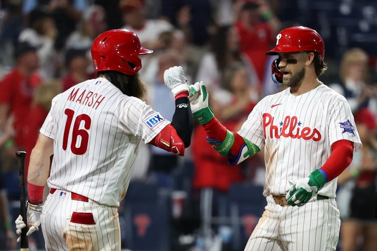 May 5, 2026; Philadelphia, Pennsylvania, USA; Philadelphia Phillies first baseman Bryce Harper (3) high fives left fielder Brandon Marsh (16) after hitting a two RBI home run during the eighth inning against the Athletics at Citizens Bank Park. Mandatory Credit: Bill Streicher-Imagn Images