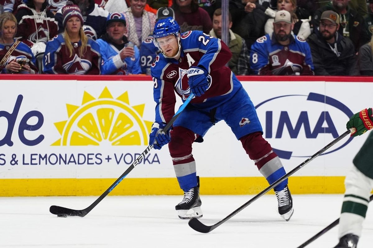 May 5, 2026; Denver, Colorado, USA; Colorado Avalanche center Nathan MacKinnon (29) takes a shot against the Minnesota Wild net during the second period in game two of the second round of the 2026 Stanley Cup Playoffs at Ball Arena. Mandatory Credit: Ron Chenoy-Imagn Images