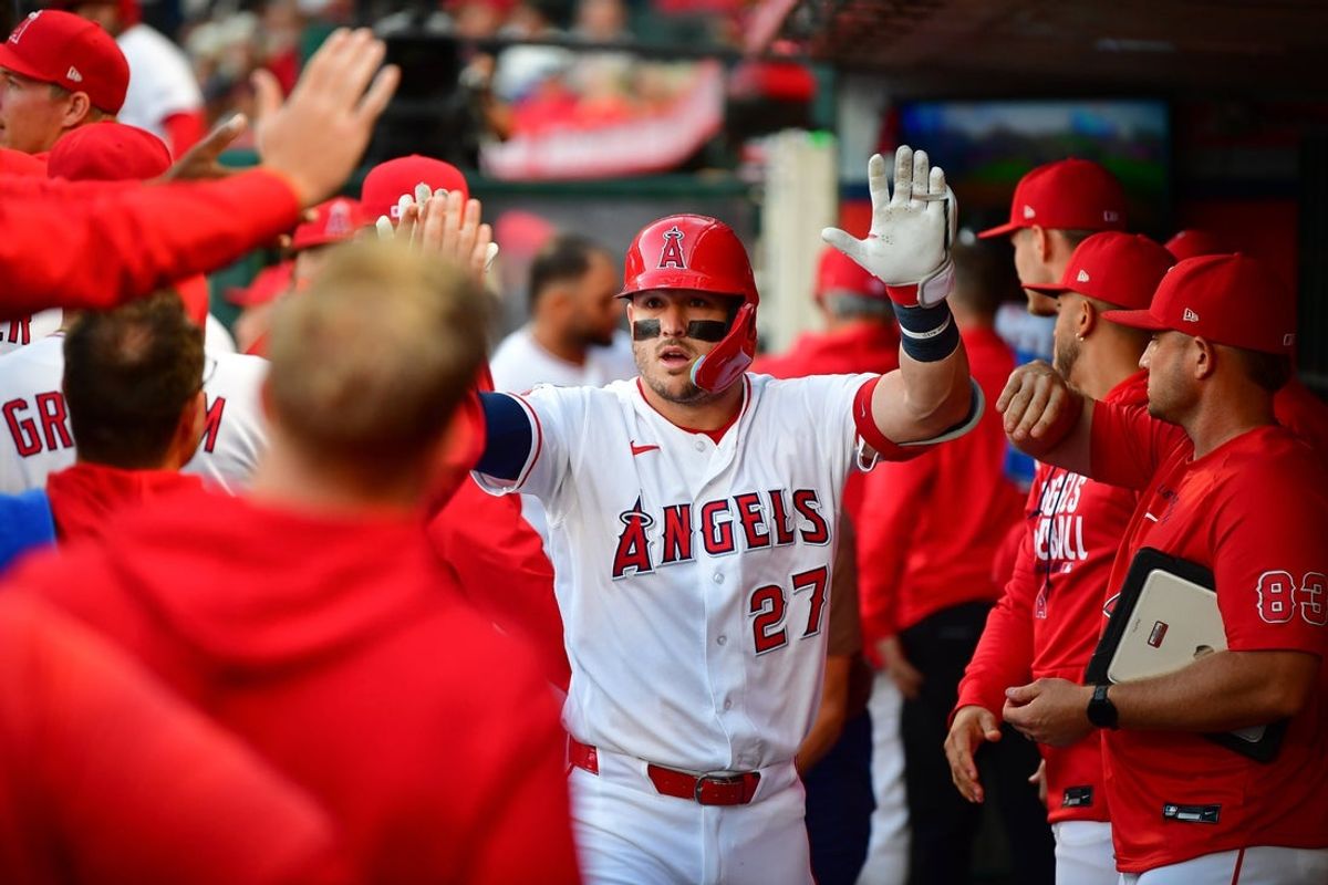 May 5, 2026; Anaheim, California, USA; Los Angeles Angels center fielder Mike Trout (27) is greeted after hitting a solo home run against the Chicago White Sox during the first inning at Angel Stadium. Mandatory Credit: Gary A. Vasquez-Imagn Images