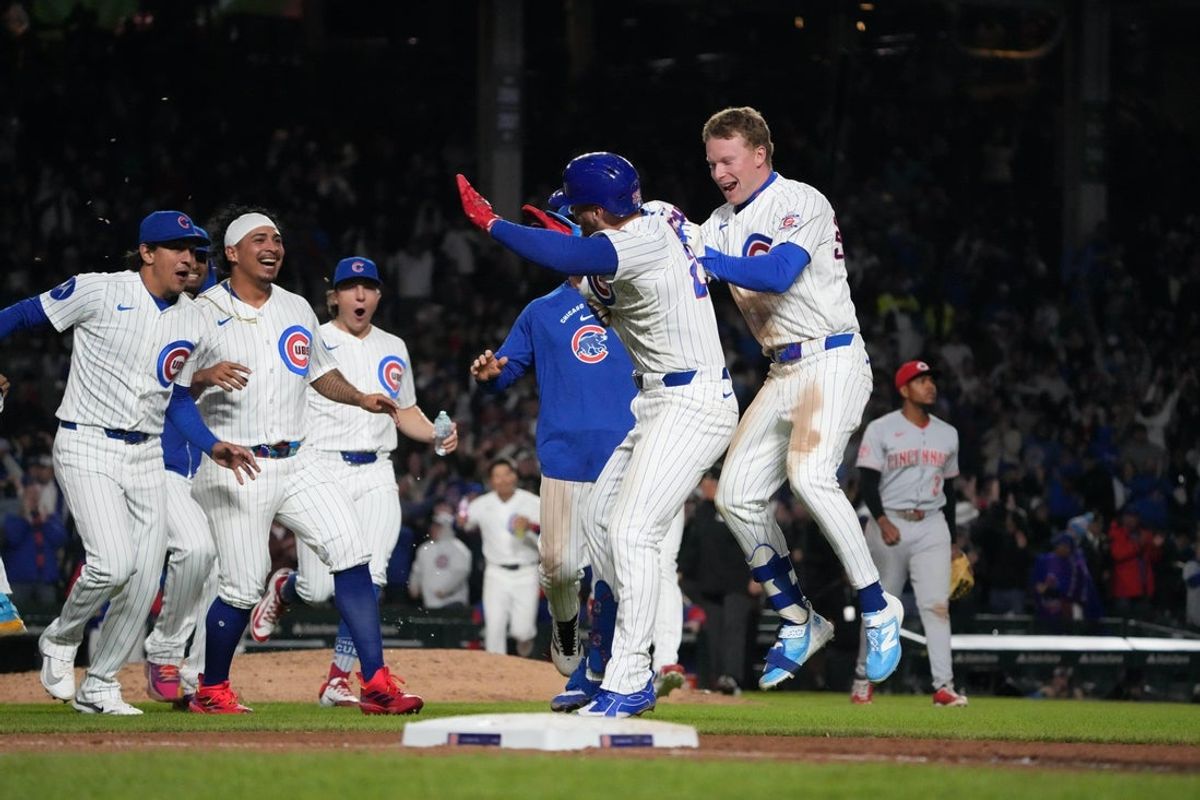 May 5, 2026; Chicago, Illinois, USA; Chicago Cubs first baseman Michael Busch (29) celebrates his walk-off single during the tenth inning against the Cincinnati Reds with center fielder Pete Crow-Armstrong (4)  at Wrigley Field. Mandatory Credit: David Banks-Imagn Images