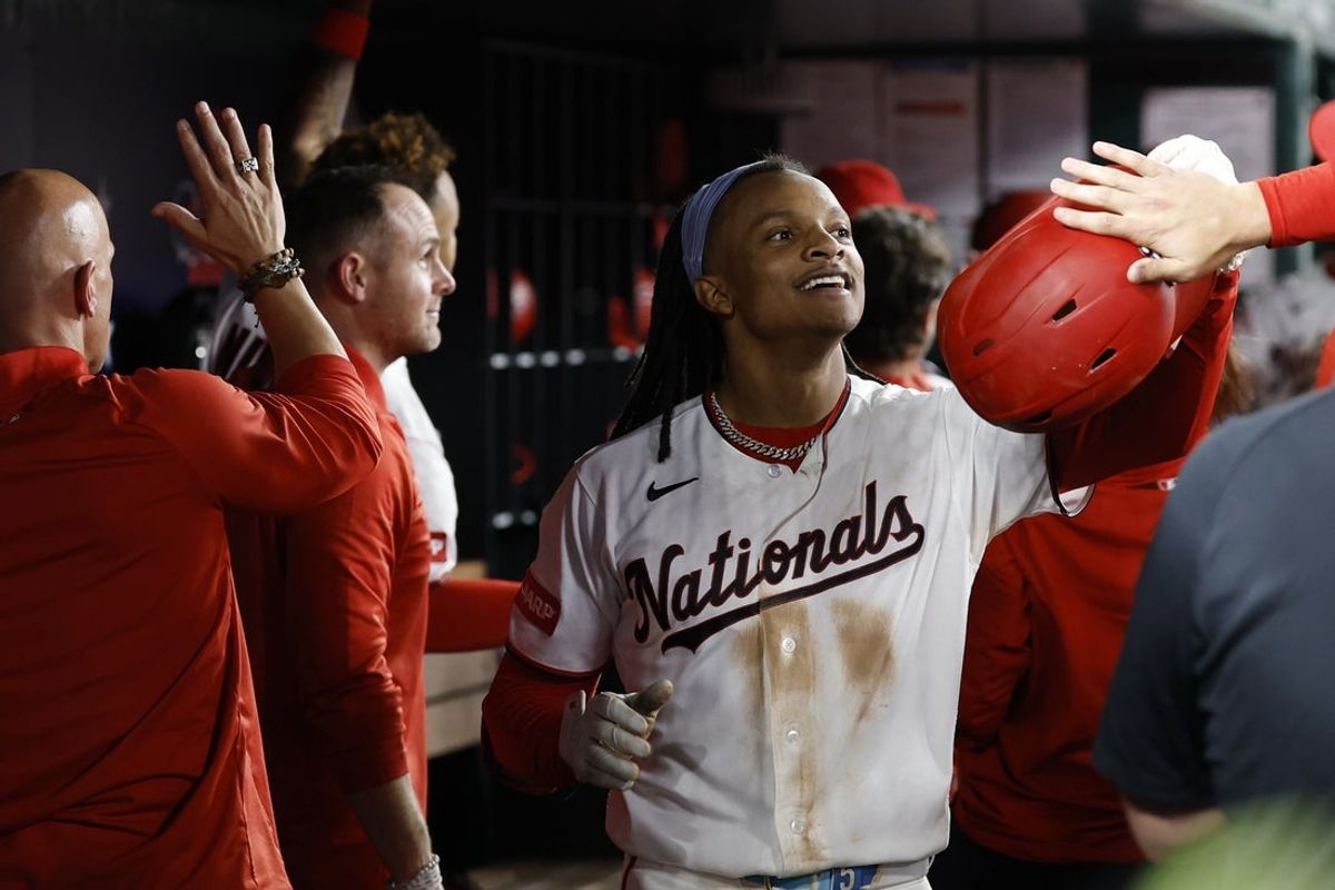 May 6, 2026; Washington, District of Columbia, USA; Washington Nationals shortstop CJ Abrams (5) celebrates with teammates in the dugout after hitting a grand slam against the Minnesota Twins during the eighth inning at Nationals Park. Mandatory Credit: Geoff Burke-Imagn Images