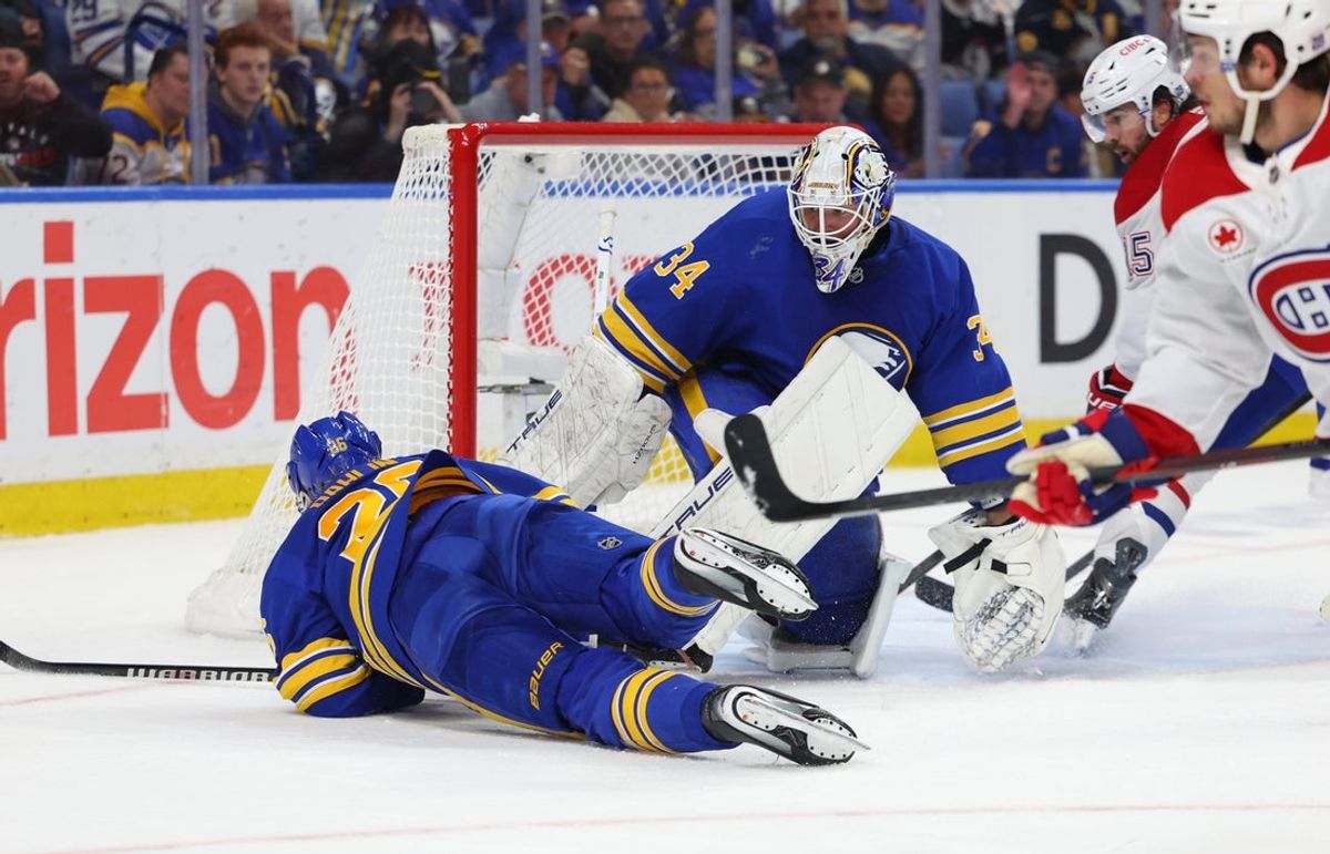 May 6, 2026; Buffalo, New York, USA; Buffalo Sabres goaltender Alex Lyon (34) looks for the puck after defenseman Rasmus Dahlin (26) blocks a shot during the third period against the Montréal Canadiens in game one of the second round of the 2026 Stanley Cup Playoffs at KeyBank Center. Mandatory Credit: Timothy T. Ludwig-Imagn Images