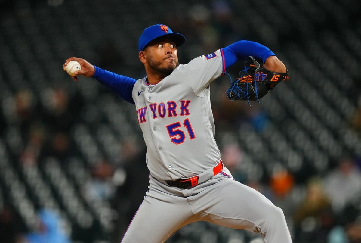 May 6, 2026; Denver, Colorado, USA;  New York Mets starting pitcher Freddy Peralta (51) delivers a pitch in the fourth inning against the Colorado Rockies at Coors Field. Mandatory Credit: Ron Chenoy-Imagn Images