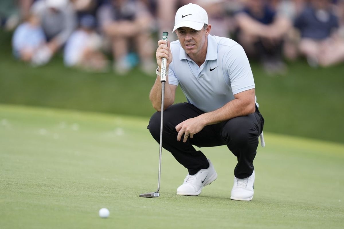May 8, 2026; Charlotte, North Carolina, USA; Rory McIlroy eyes his line on 18 during the second round of the Truist Championship golf tournament. Mandatory Credit: Jim Dedmon-Imagn Images