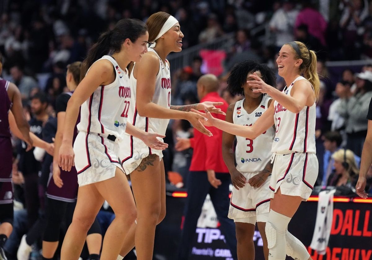 May 8, 2026; Toronto, Ontario, CAN; Washington Mystics center Shakira Austin (0) celebrates a win with guard Lucy Olsen (33) against the Toronto Tempo at the end of the fourth quarter at Coca-Cola Coliseum. Mandatory Credit: Nick Turchiaro-Imagn Images