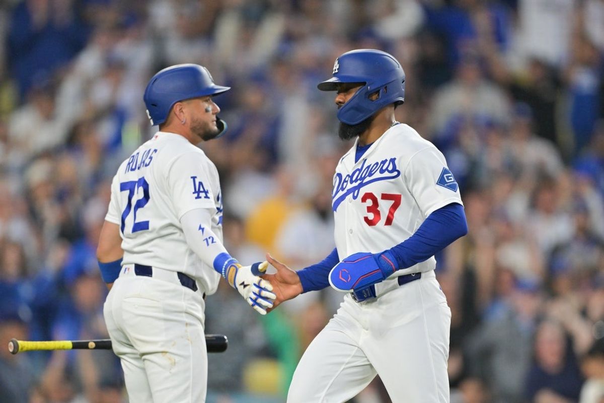 May 8, 2026; Los Angeles, California, USA; Los Angeles Dodgers left fielder Teoscar Hernández (37) celebrates with Los Angeles Dodgers shortstop Miguel Rojas (72) after scoring a run during the second inning against the Atlanta Braves at Dodger Stadium. Mandatory Credit: Jayne Kamin-Oncea-Imagn Images