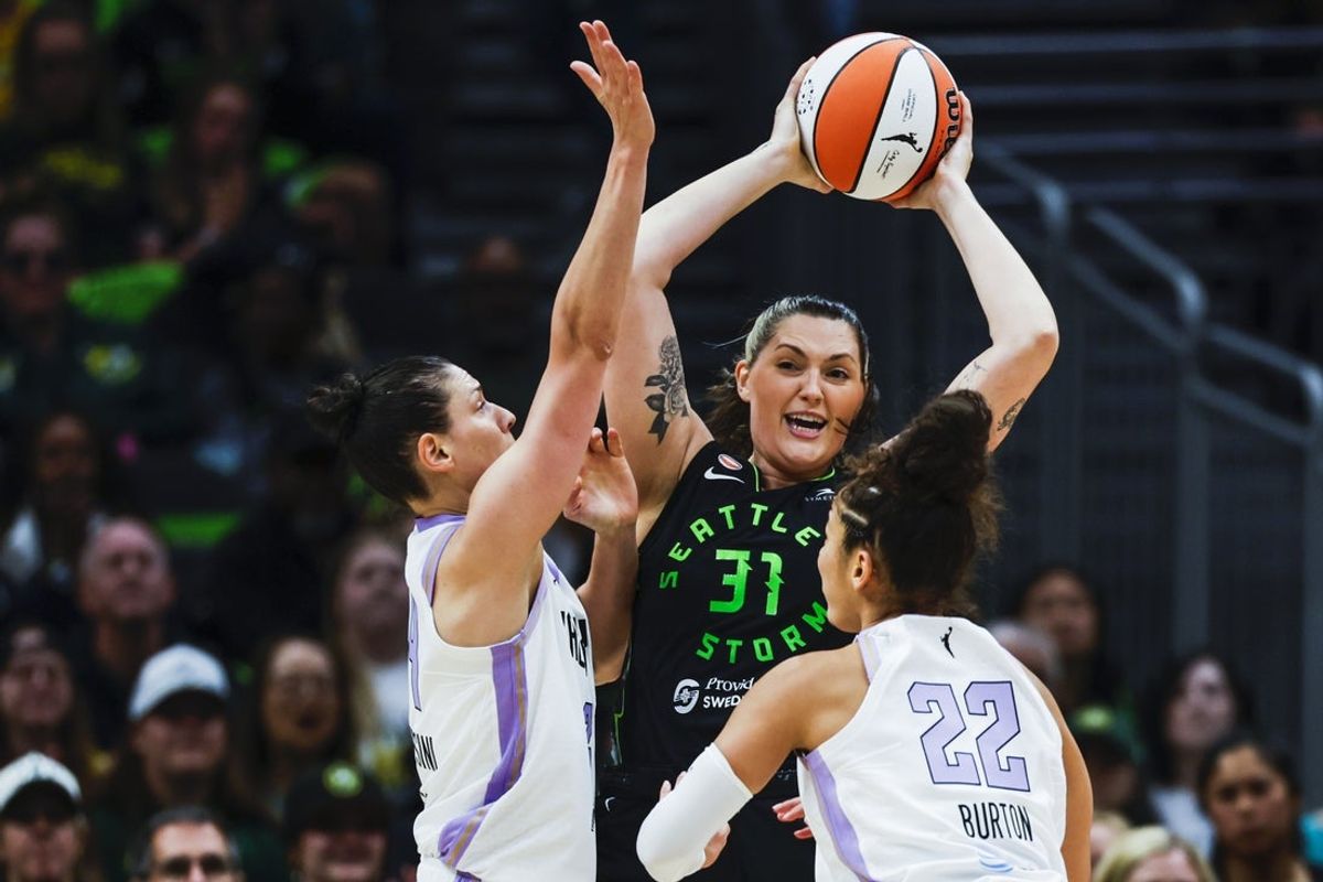 May 8, 2026; Seattle, Washington, USA; Seattle Storm center Stefanie Dolson (31) passes away from a double team by Golden State Valkyries forward Cecilia Zandalasini (24) and guard Veronica Burton (22) during the first quarter at Climate Pledge Arena. Mandatory Credit: Joe Nicholson-Imagn Images