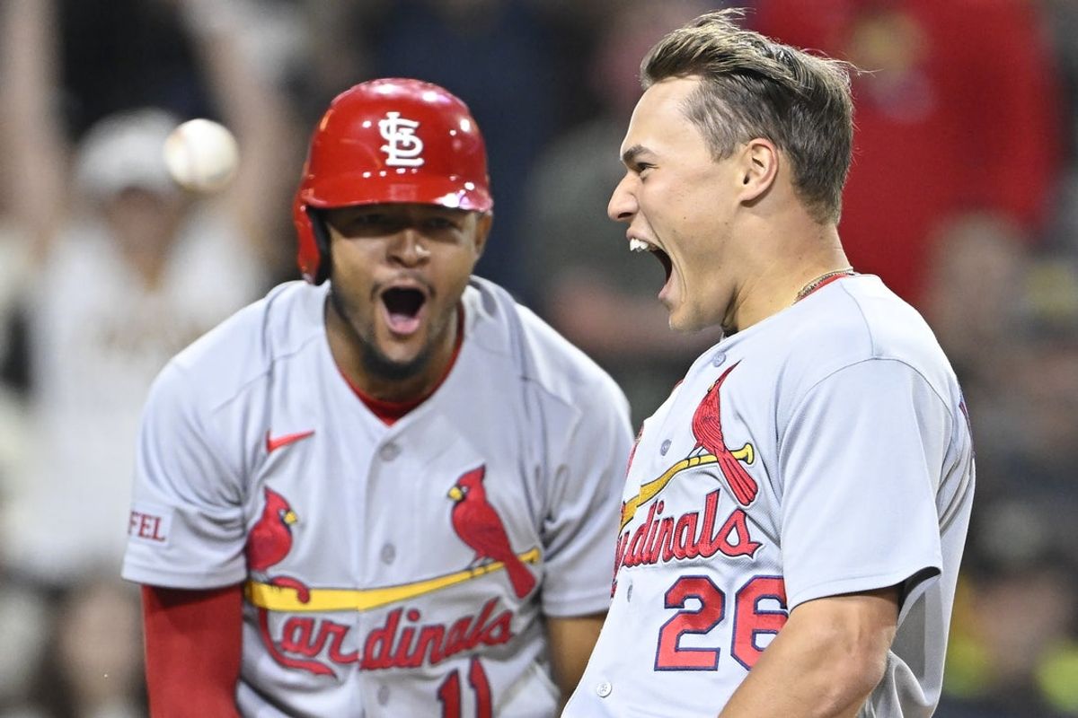 May 8, 2026; San Diego, California, USA; St. Louis Cardinals second baseman JJ Wetherholt (26), right, celebrates with center fielder Victor Scott II (11) after scoring during the fifth inning against the San Diego Padres at Petco Park. Mandatory Credit: Denis Poroy-Imagn Images