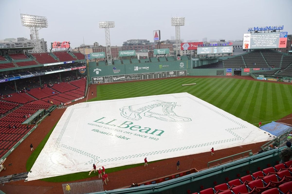 May 9, 2026; Boston, Massachusetts, USA;  A view of the tarp on the field after the game between the Boston Red Sox and Tampa Bay Rays had been postponed at Fenway Park. Mandatory Credit: Bob DeChiara-Imagn Images