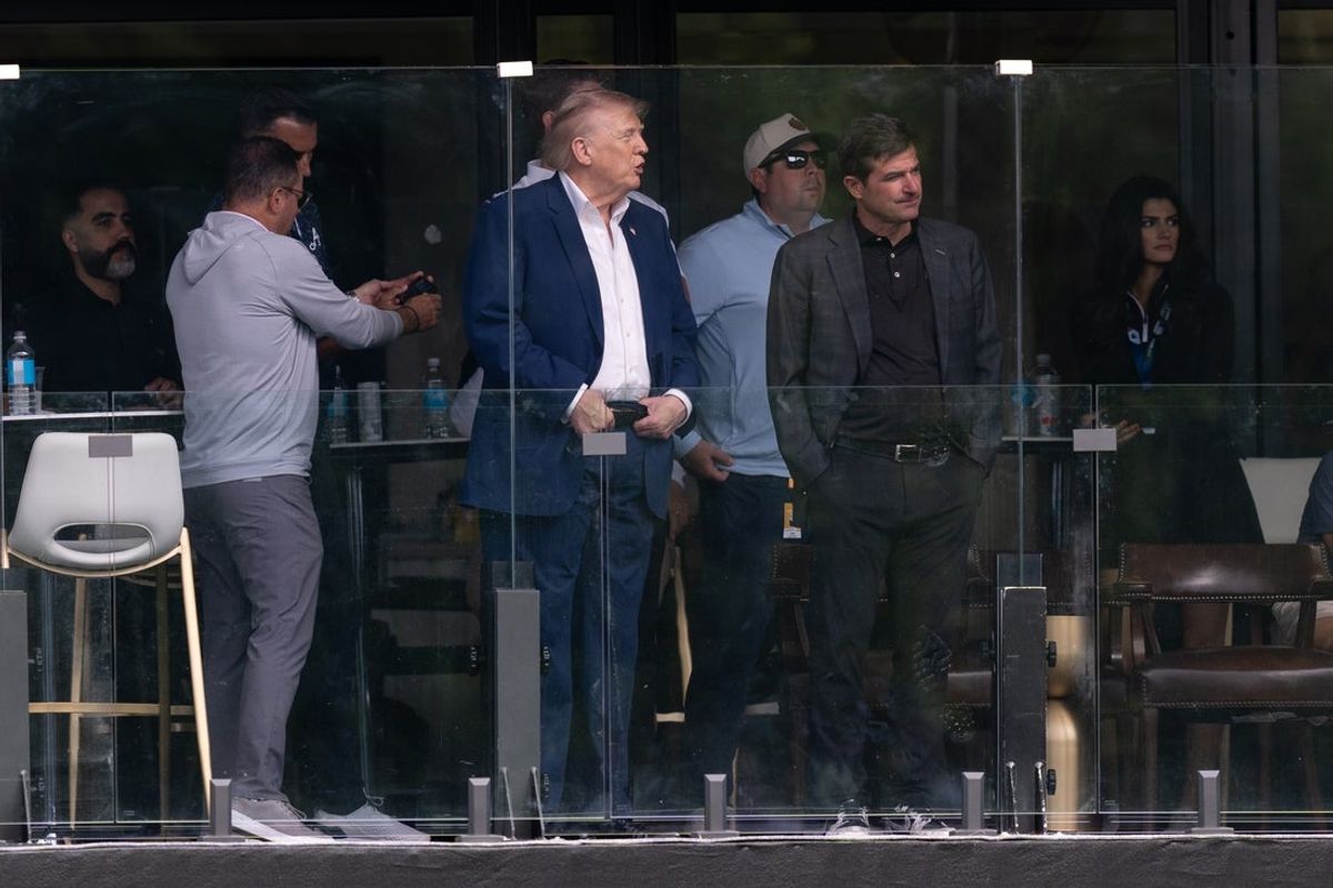 May 9, 2026; Sterling, Virginia, USA; President Donald J. Trump speaks with LIV Golf CEO Scott O'Neil during the third round of LIV Golf Virginia golf tournament at Trump National Golf Club. Mandatory Credit: John (Jack) Power-Imagn Images