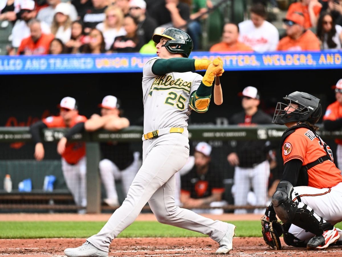 May 9, 2026; Baltimore, Maryland, USA; Athletics designated hitter Brent Rooker (25) hits a three run home run during the third inning against the Baltimore Orioles at Oriole Park at Camden Yards. Mandatory Credit: James A. Pittman-Imagn Images