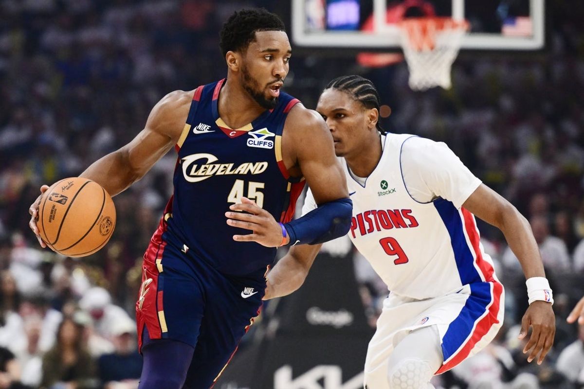 May 9, 2026; Cleveland, Ohio, USA; Cleveland Cavaliers guard Donovan Mitchell (45) drives to the basket against Detroit Pistons guard Ausar Thompson (9) during the second half of game three in the second round of the 2026 NBA Playoffs at Rocket Arena. Mandatory Credit: Ken Blaze-Imagn Images