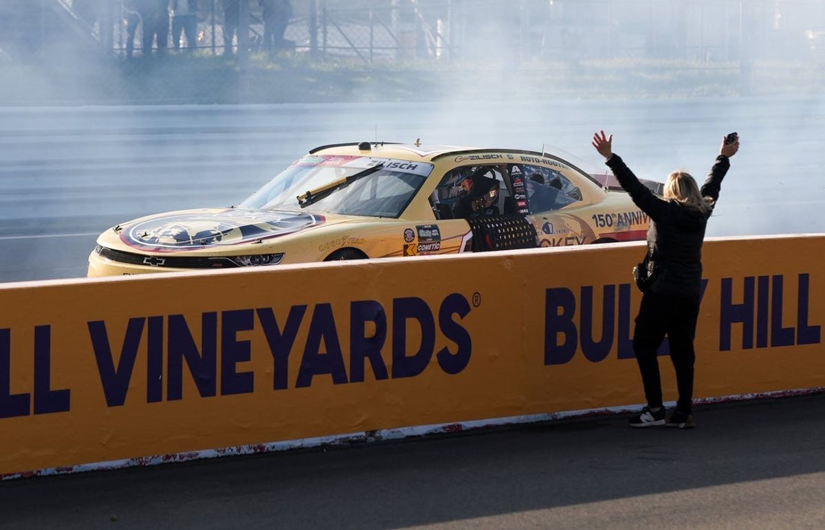 May 9, 2026; Watkins Glen, New York, USA; NASCAR O’Reilly Auto Parts Series driver Connor Zilisch (1) celebrates after winning the Mission 200 at Watkins Glen International. Mandatory Credit: Matthew O'Haren-Imagn Images