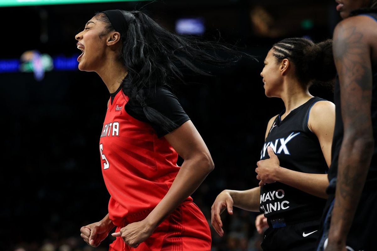 May 9, 2026; Minneapolis, Minnesota, USA; Atlanta Dream forward Angel Reese (5) celebrates a basket against the Minnesota Lynx during the first half at Target Center. Mandatory Credit: Matt Krohn-Imagn Images