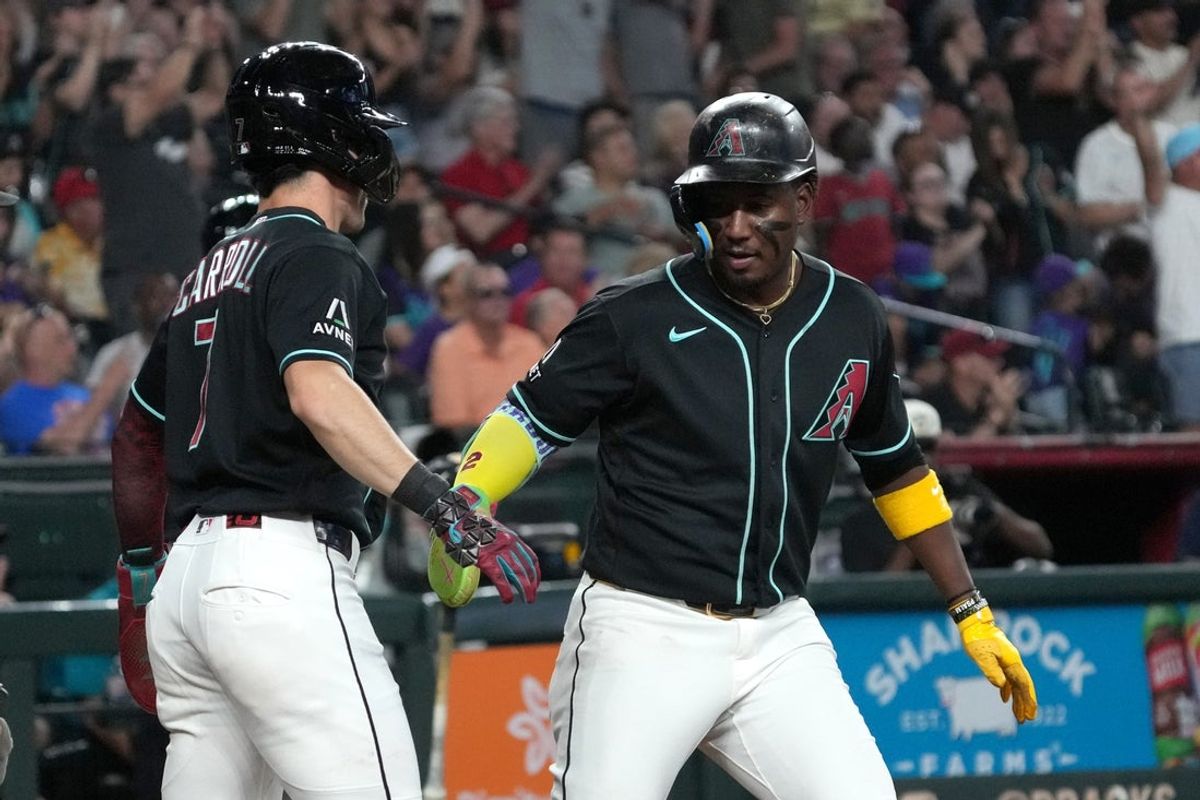 May 9, 2026; Phoenix, Arizona, USA; Arizona Diamondbacks shortstop Geraldo Perdomo (2) scores a run against the New York Mets in the third inning at Chase Field. Mandatory Credit: Rick Scuteri-Imagn Images
