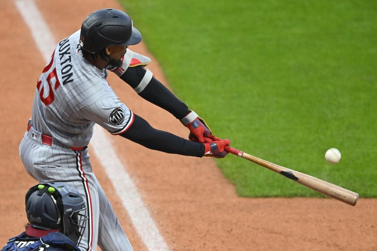 May 9, 2026; Cleveland, Ohio, USA; Minnesota Twins center fielder Byron Buxton (25) hits a solo home run in the first inning against the Cleveland Guardians at Progressive Field. Mandatory Credit: David Richard-Imagn Images