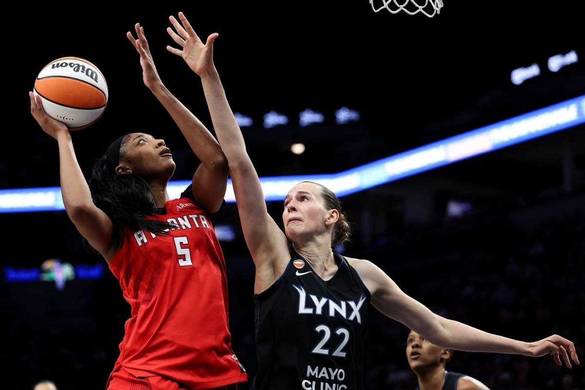 May 9, 2026; Minneapolis, Minnesota, USA; Atlanta Dream forward Angel Reese (5) shoots as Minnesota Lynx center Emma Cechova (22) defends during the first half at Target Center. Mandatory Credit: Matt Krohn-Imagn Images