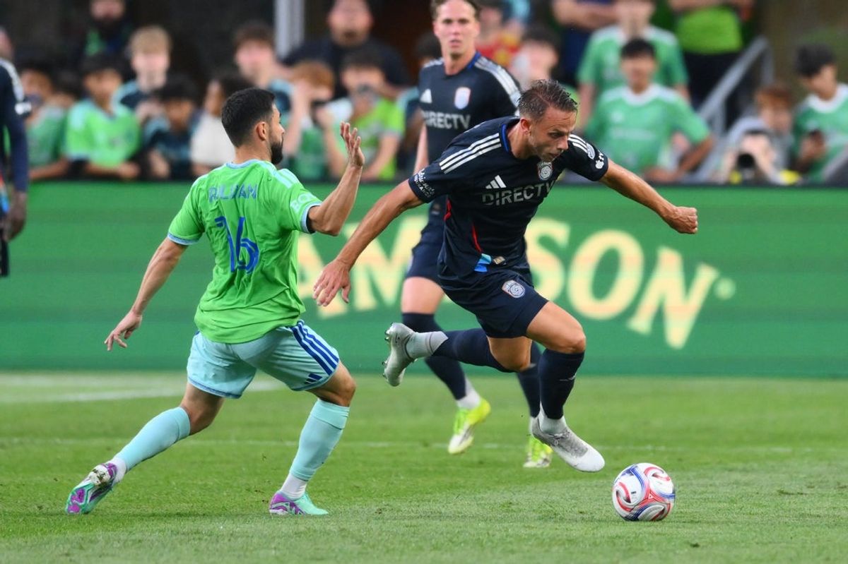 May 9, 2026; Seattle, Washington, USA; San Diego FC forward Marcus Ingvartsen (7) plays the ball while defended by Seattle Sounders FC defender Alex Roldan (16) during the first half at Lumen Field. Mandatory Credit: Steven Bisig-Imagn Images