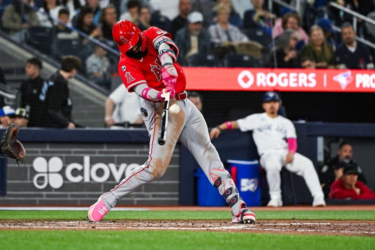 May 10, 2026; Toronto, Ontario, CAN; Los Angeles Angels right fielder Jo Adell (7) hits the ball for a home run against the Toronto Blue Jays in the sixth inning at Rogers Centre. Mandatory Credit: David Kirouac-Imagn Images