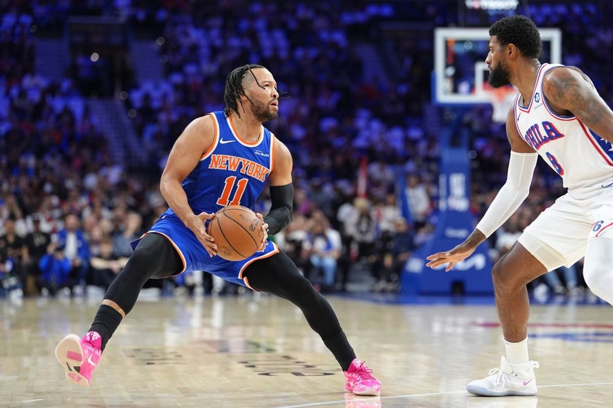 May 10, 2026; Philadelphia, Pennsylvania, USA; New York Knicks guard Jalen Brunson (11) controls the ball against Philadelphia 76ers forward Paul George (8) in the first quarter during game four of the second round of the 2026 NBA Playoffs at Xfinity Mobile Arena. Mandatory Credit: Kyle Ross-Imagn Images