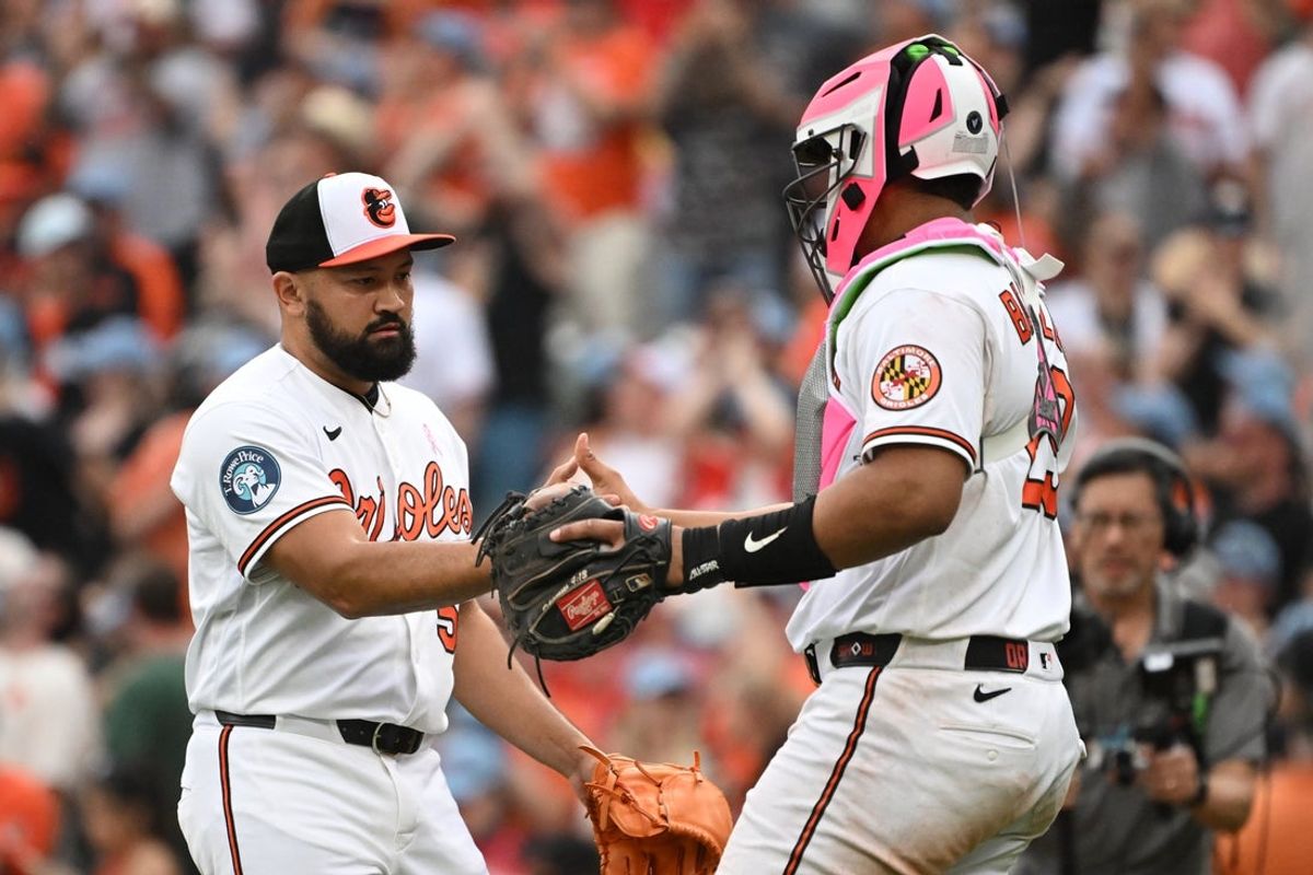 May 10, 2026; Baltimore, Maryland, USA; Baltimore Orioles pitcher Rico Garcia (50) and catcher Samuel Basallo (29) celebrate after defeating the Athletics at Oriole Park at Camden Yards. Mandatory Credit: Rafael Suanes-Imagn Images