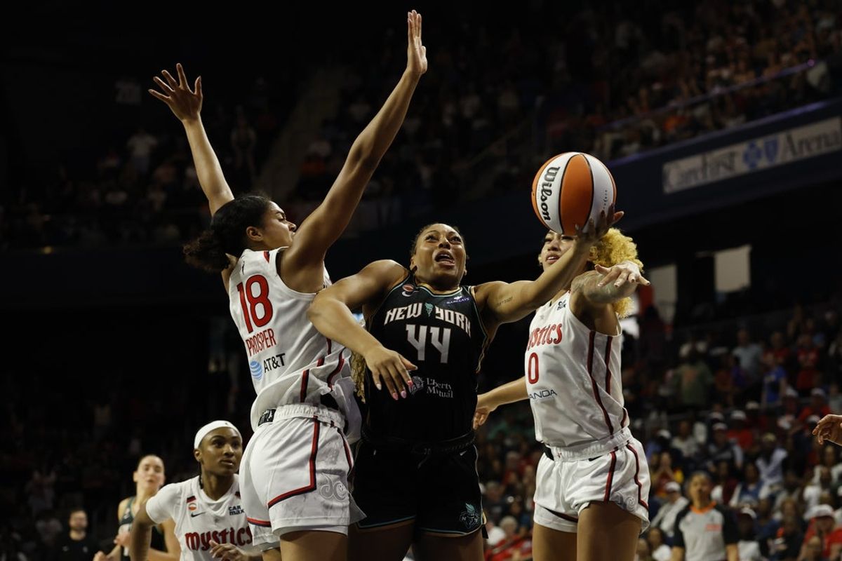 May 10, 2026; Washington, District of Columbia, USA; New York Liberty guard-forward Betnijah Laney-Hamilton (44) is fouled by Washington Mystics guard Cassandre Prosper (18) while shooting in overtime at CareFirst Arena. Mandatory Credit: Geoff Burke-Imagn Images