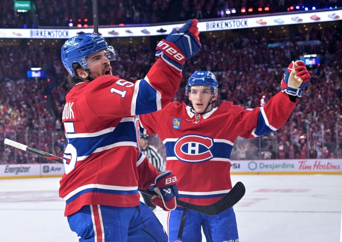 May 10, 2026; Montreal, Quebec, CAN; Montreal Canadiens forward Alex Newhook (15) celebrates with teammate defenseman Lane Hutson (48) after scoring a goal against the Buffalo Sabresduring the first period in game three of the second round of the 2026 Stanley Cup Playoffs at the Bell Centre. Mandatory Credit: Eric Bolte-Imagn Images