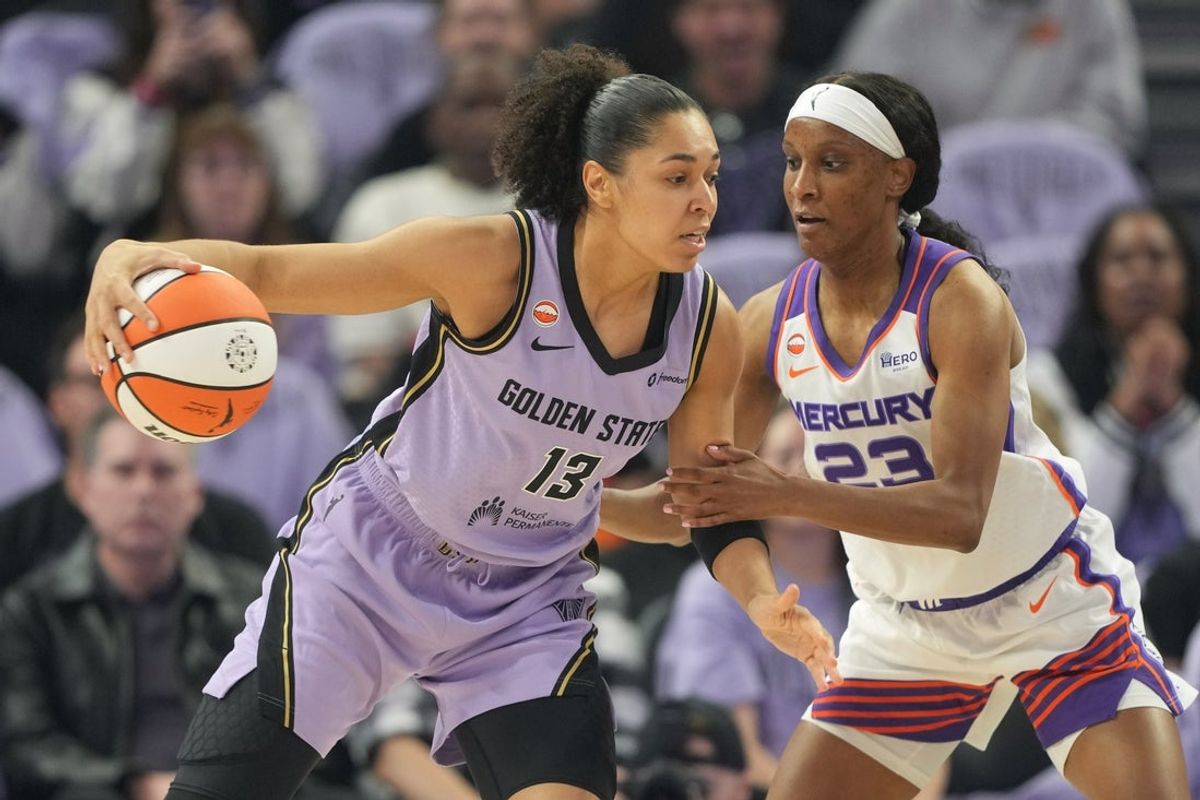 May 10, 2026; San Francisco, California, USA; Golden State Valkyries forward Janelle Salaun (13) dribbles against Phoenix Mercury guard Kiana Williams (23) during the first quarter at Chase Center. Mandatory Credit: Darren Yamashita-Imagn Images
