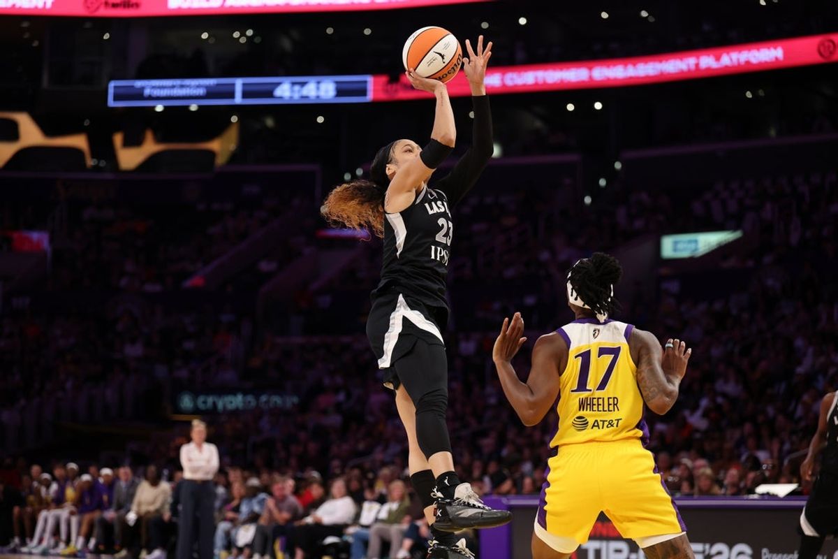 May 10, 2026; Los Angeles, California, USA;  Las Vegas Aces guard Chennedy Carter (23) shoots the ball over Los Angeles Sparks guard Erica Wheeler (17) during the third quarter at Crypto.com Arena. Mandatory Credit: Kiyoshi Mio-Imagn Images