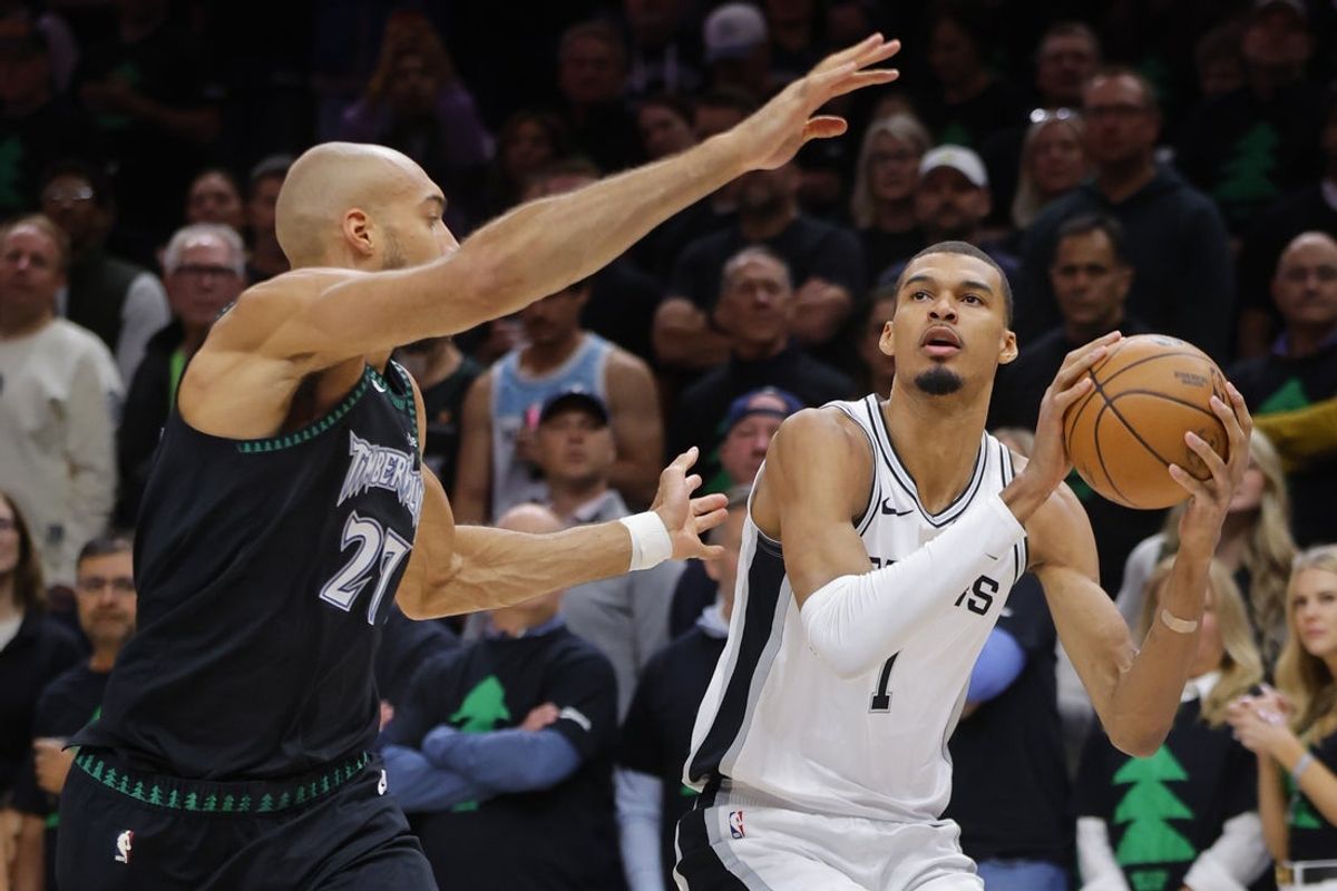 May 10, 2026; Minneapolis, Minnesota, USA; San Antonio Spurs center Victor Wembanyama (1) shoots against Minnesota Timberwolves center Rudy Gobert (27) in the first quarter of game four of the second round of the 2026 NBA Playoffs at Target Center. Mandatory Credit: Bruce Kluckhohn-Imagn Images