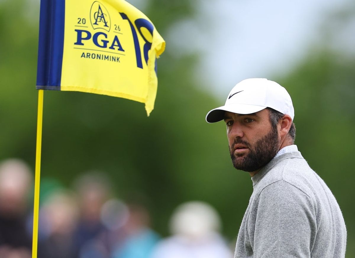 May 11, 2026; Newtown Square, Pennsylvania, Scottie Scheffler on the the eighteenth green during a practice round of the PGA Championship golf tournament at Aronimink Golf Club. Mandatory Credit: Bill Streicher-Imagn Images