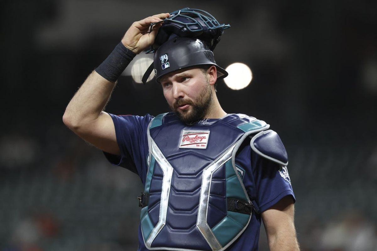 May 11, 2026; Houston, Texas, USA; Seattle Mariners catcher Cal Raleigh (29) puts on his mask after a play during the second inning against the Houston Astros at Daikin Park. Mandatory Credit: Troy Taormina-Imagn Images